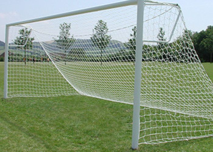 Socketed football goal on football pitch