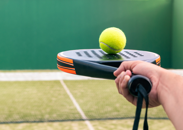 padel ball on racket