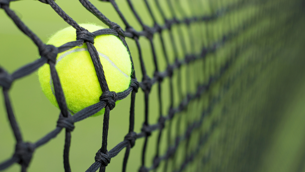 tennis ball hitting nets